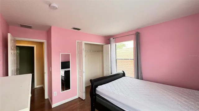 a bathroom with a toilet and shower