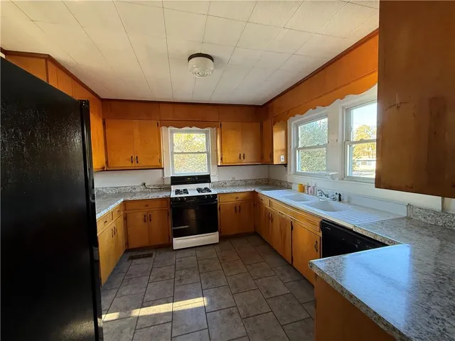 a large kitchen with a large window