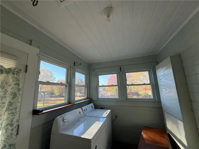 a bathroom with a sink window and mirror