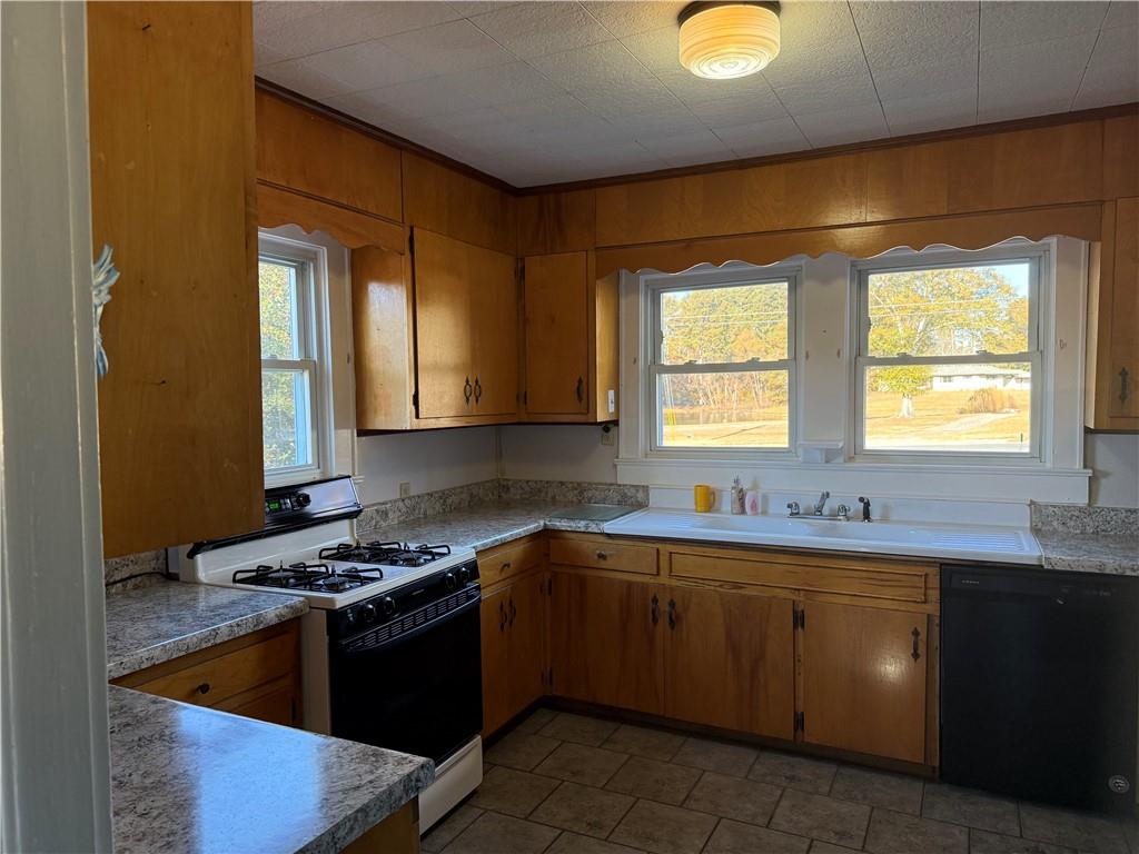 3329 Alabama Highway Rome, GA 30165 - Photo 24 of 32 a kitchen with a sink stove and cabinets