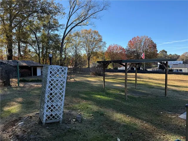 a view of road with large trees