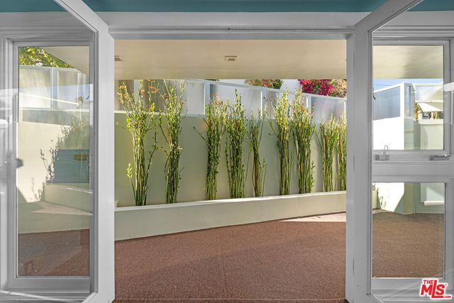 a large kitchen with stainless steel appliances granite countertop a large stove top oven