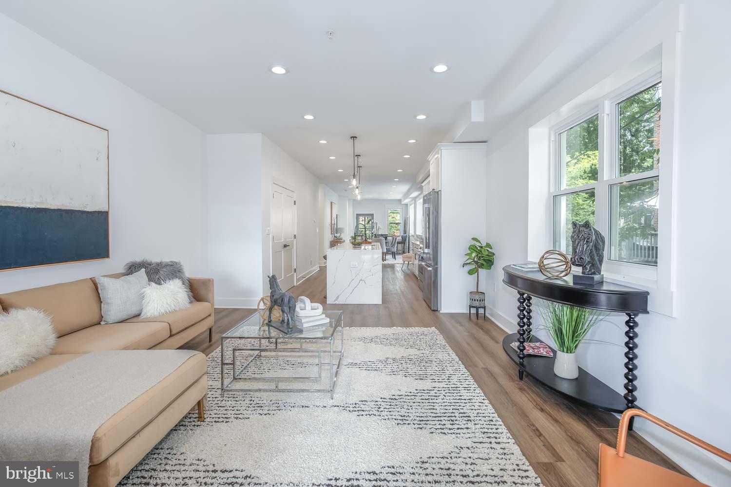 424 Taylor Street Northwest, Unit 1 Washington, DC 20011 - Photo 21 of 53 a living room with furniture and a large window