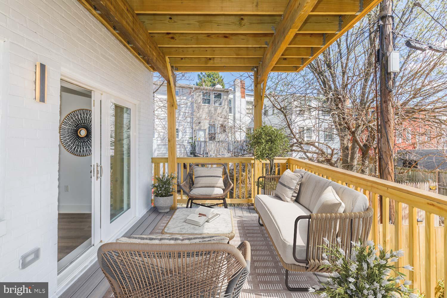 424 Taylor Street Northwest, Unit 1 Washington, DC 20011 - Photo 24 of 53 a balcony with furniture and a swing