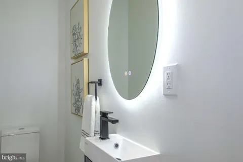 a spacious bedroom with a bed and a dresser