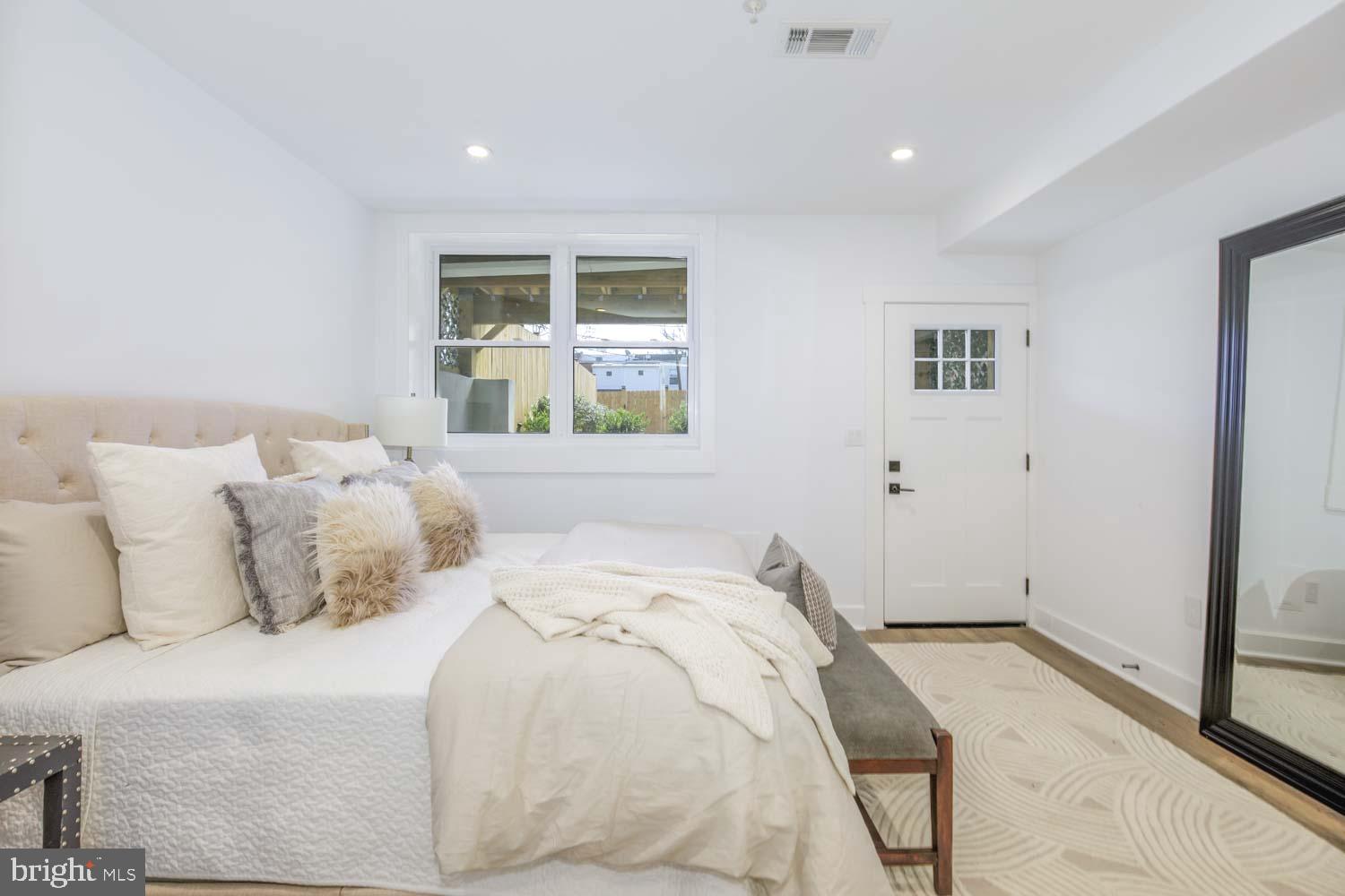 424 Taylor Street Northwest, Unit 1 Washington, DC 20011 - Photo 31 of 53 a bedroom with a bed and a window