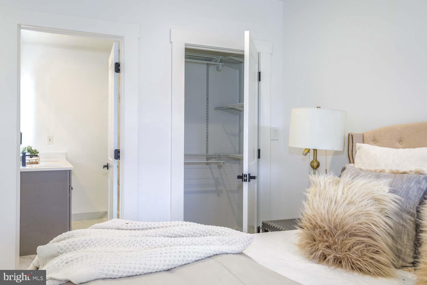 424 Taylor Street Northwest, Unit 1 Washington, DC 20011 - Photo 33 of 53 a bedroom with a bed and a mirror