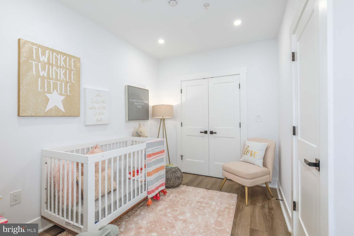 424 Taylor Street Northwest, Unit 1 Washington, DC 20011 - Photo 46 of 53 a bedroom with a bed and a table