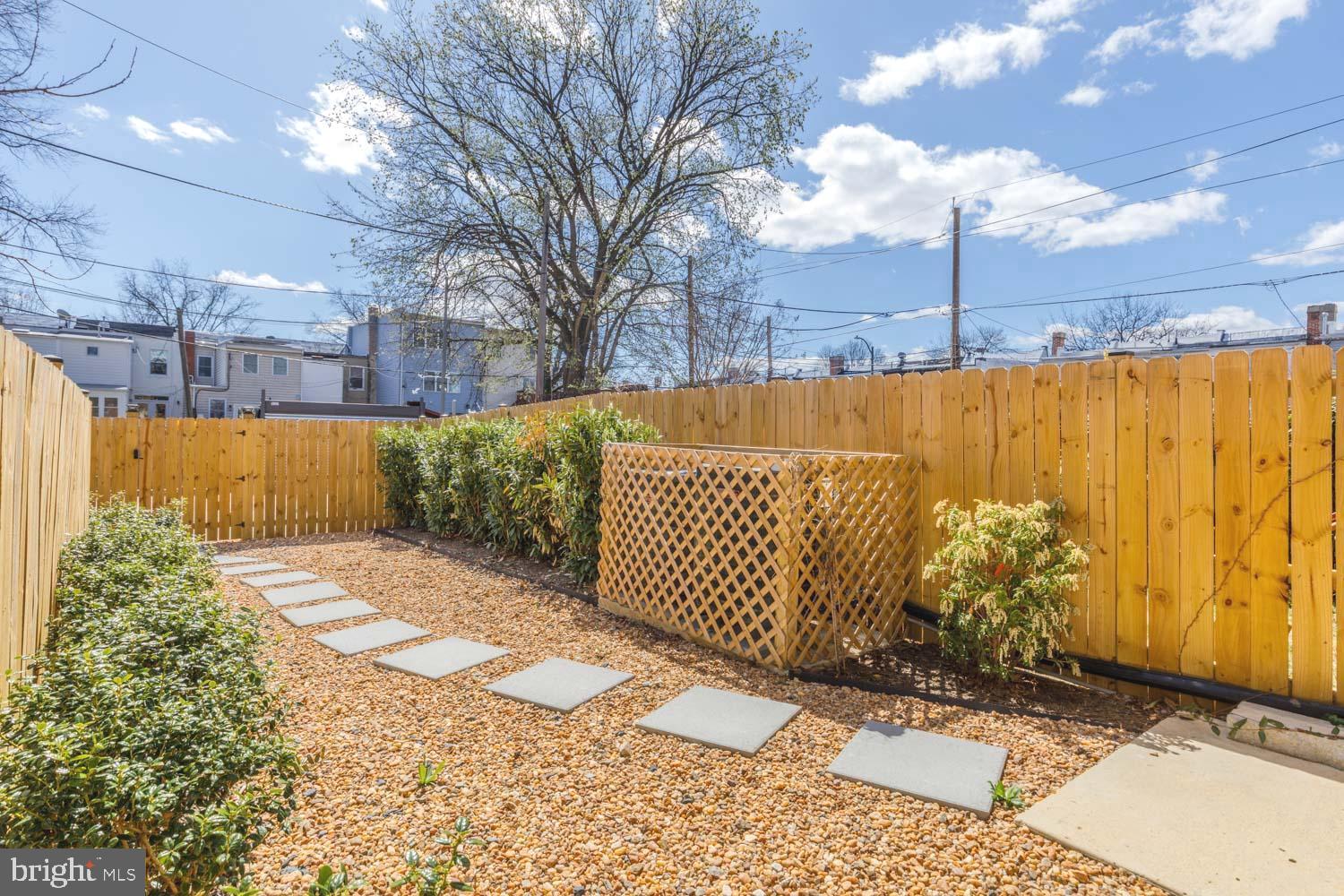 424 Taylor Street Northwest, Unit 1 Washington, DC 20011 - Photo 50 of 53 a street view with wooden fence