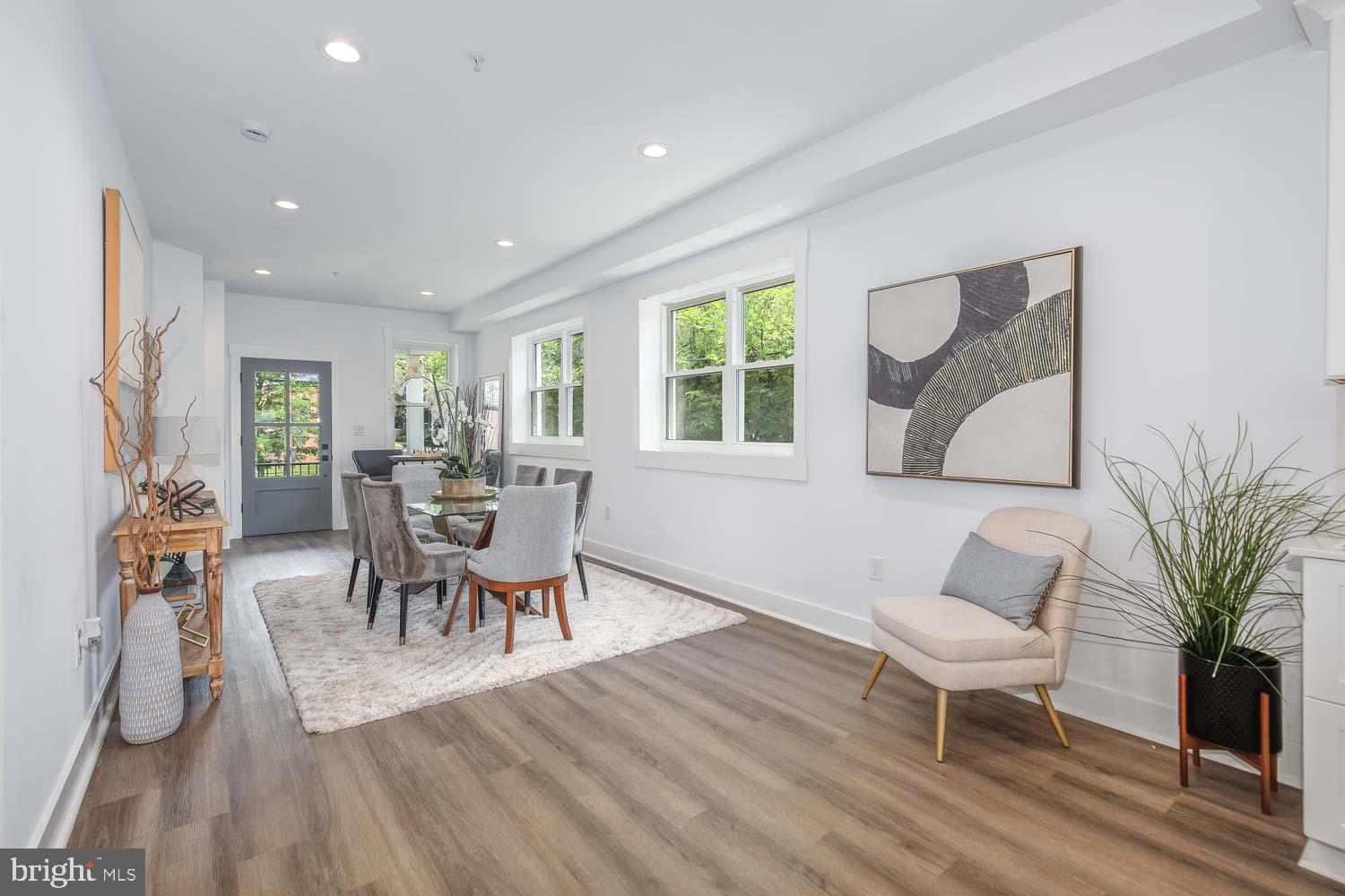 424 Taylor Street Northwest, Unit 1 Washington, DC 20011 - Photo 7 of 53 a view of a dining room with furniture window and wooden floor