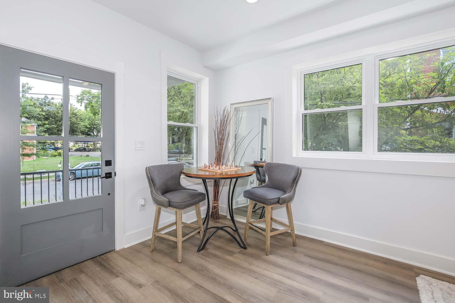 424 Taylor Street Northwest, Unit 1 Washington, DC 20011 - Photo 8 of 53 a view of a dining room with furniture window and outside view