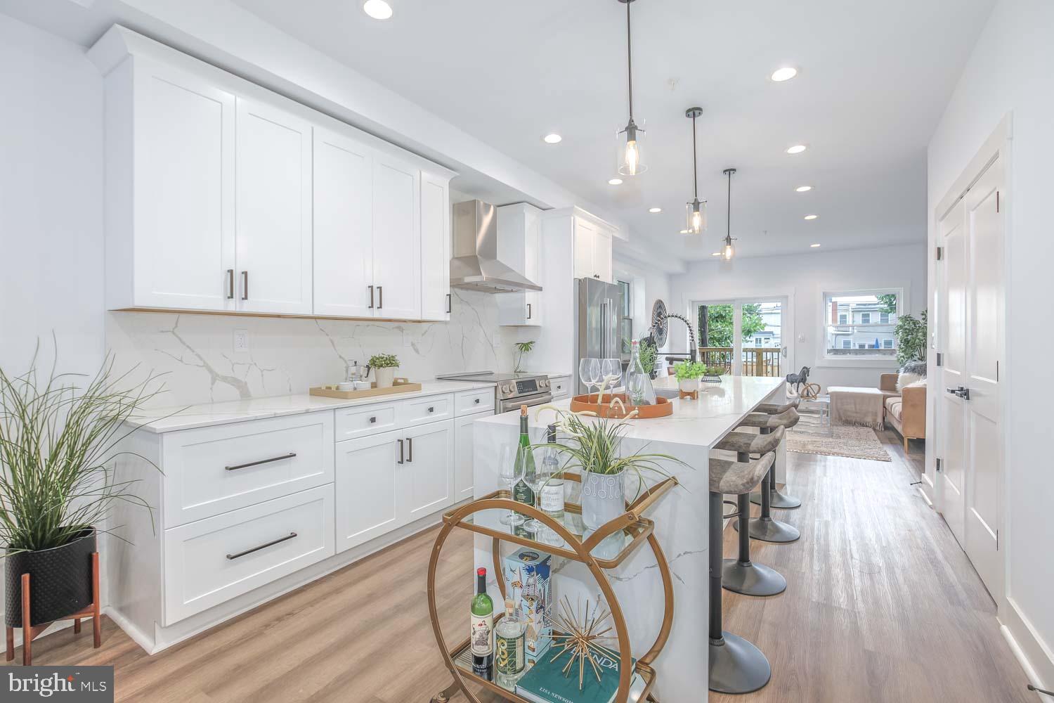 424 Taylor Street Northwest, Unit 1 Washington, DC 20011 - Photo 10 of 53 a view of a dining room with furniture wooden floor and a rug