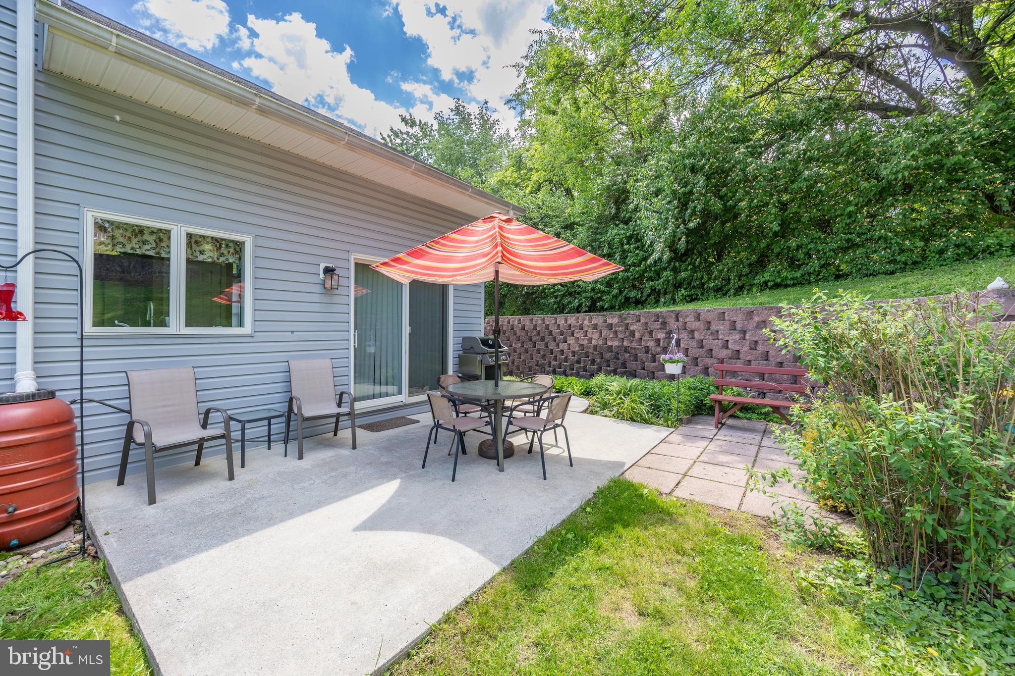 237 Poplar Street Spring City, PA 19475 - Photo 31 of 36 a view of a patio with table and chairs under an umbrella