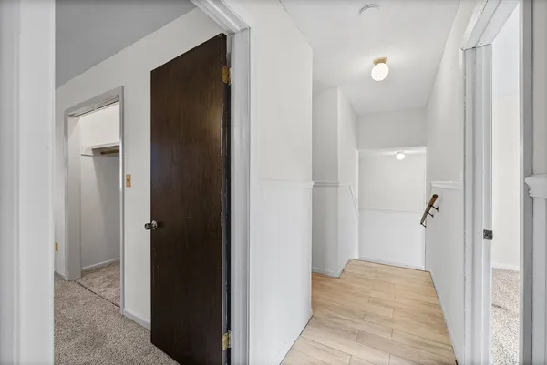 a view of a bathroom from a hallway