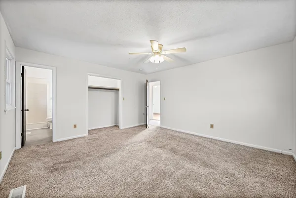 an empty room with a bathroom