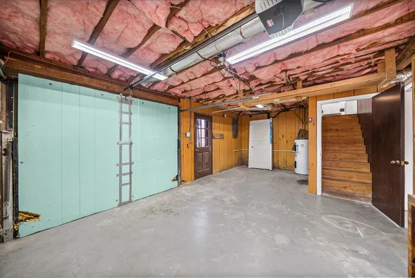 a view of a room with wooden walls