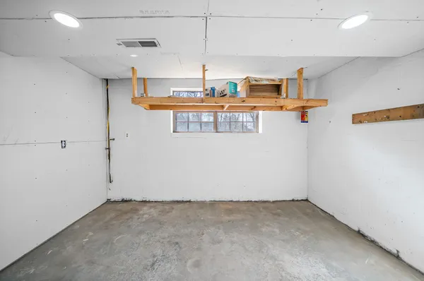 an empty room with view of bathroom