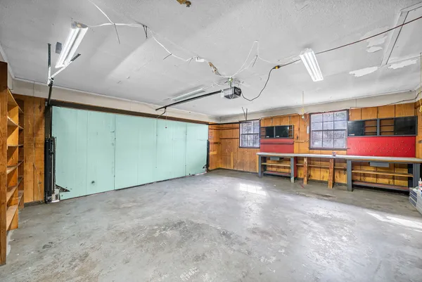 a view of a room with lots of furniture and furniture