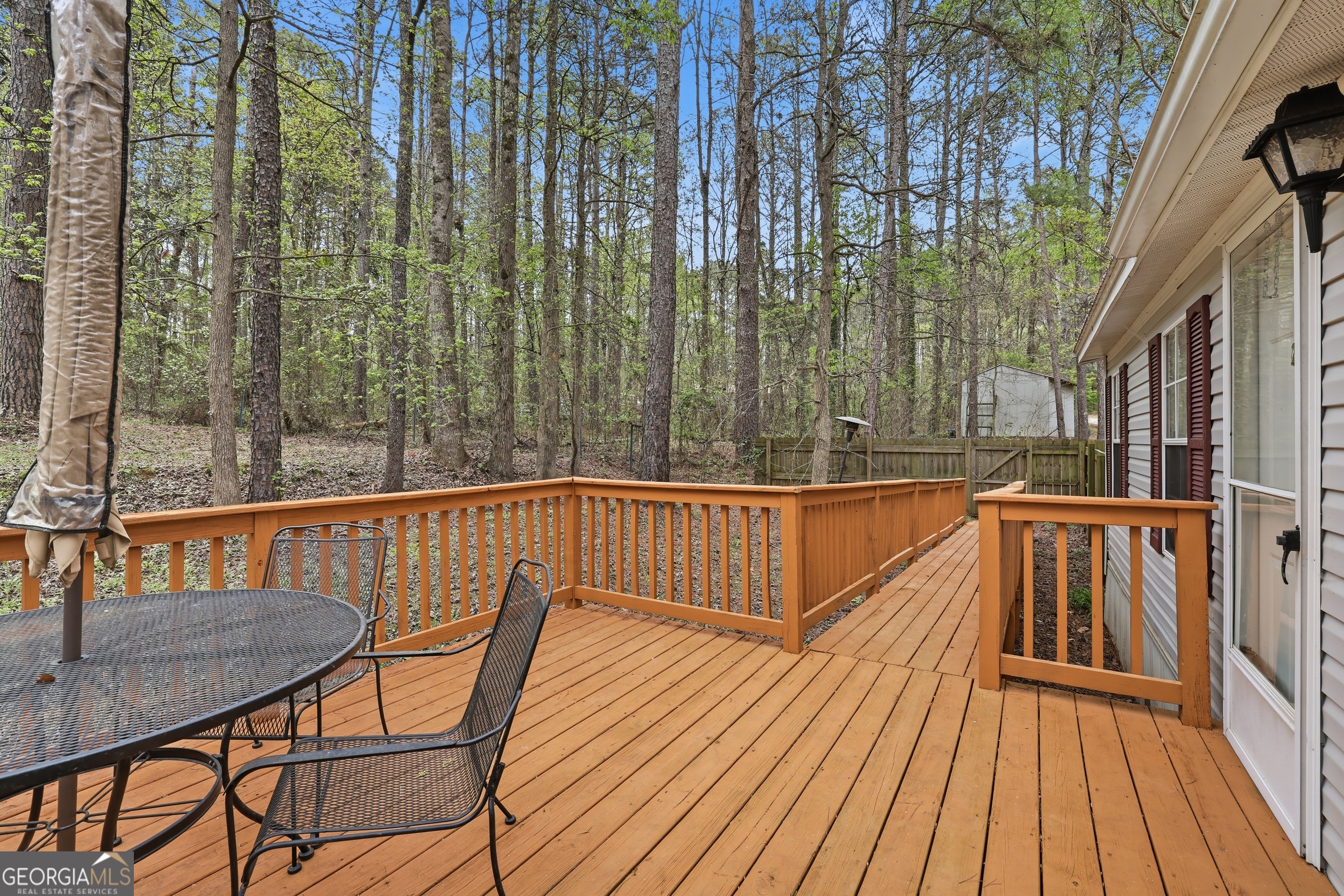 2533 McFarlin Bridge Road Carnesville, GA 30521 - Photo 27 of 37 a view of balcony with wooden floor and outdoor seating