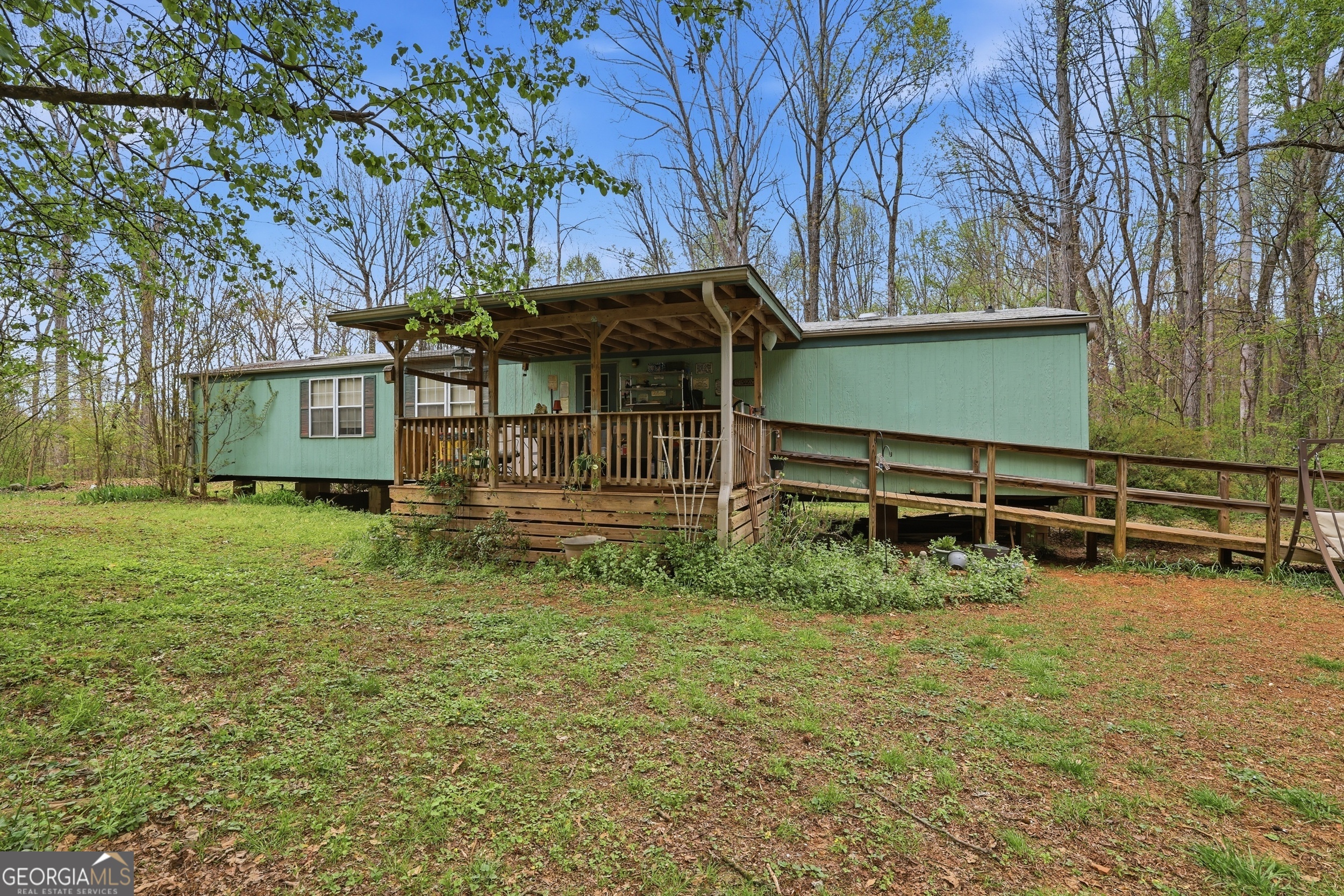2533 McFarlin Bridge Road Carnesville, GA 30521 - Photo 30 of 37 a view of a house with a yard