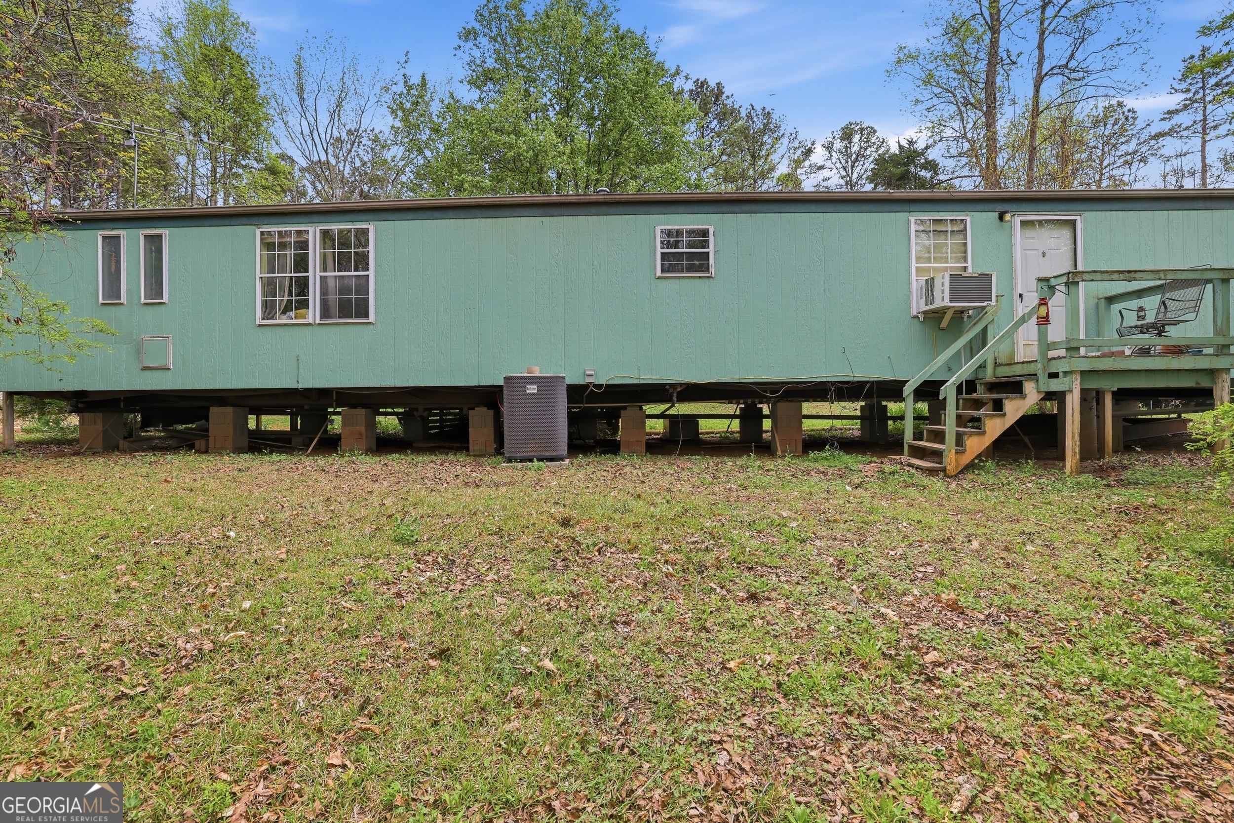 2533 McFarlin Bridge Road Carnesville, GA 30521 - Photo 32 of 37 a view of house with backyard space and balcony