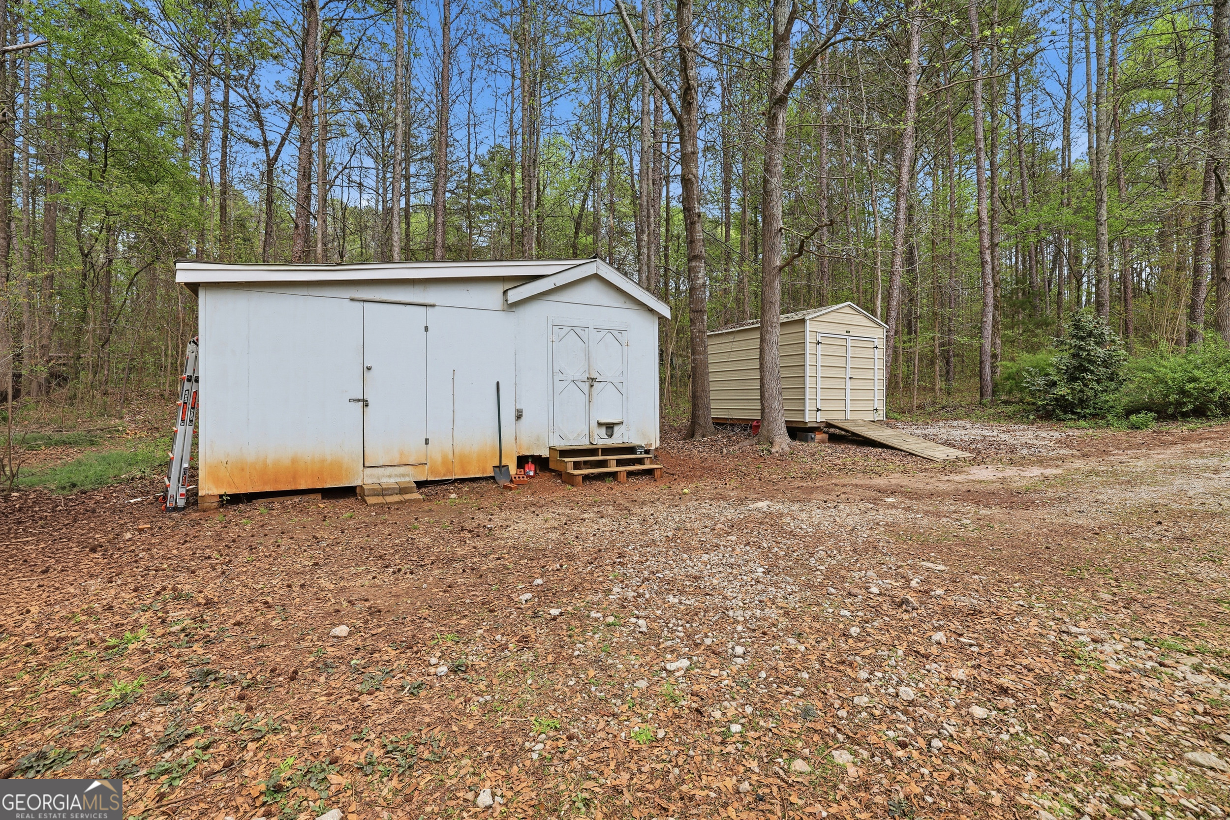 2533 McFarlin Bridge Road Carnesville, GA 30521 - Photo 33 of 37 a view of a house with a backyard and tree