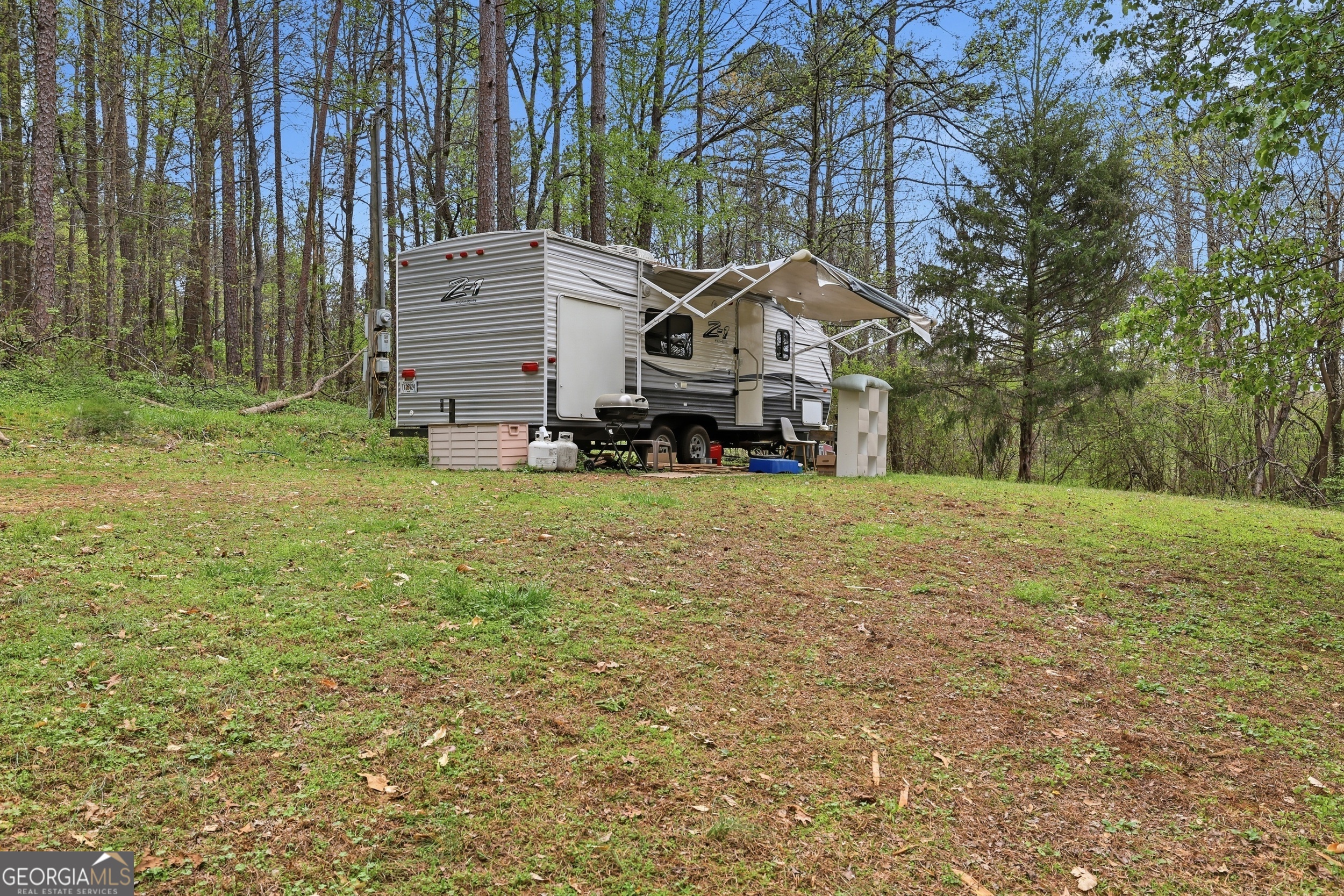 2533 McFarlin Bridge Road Carnesville, GA 30521 - Photo 34 of 37 a view of a house with a yard
