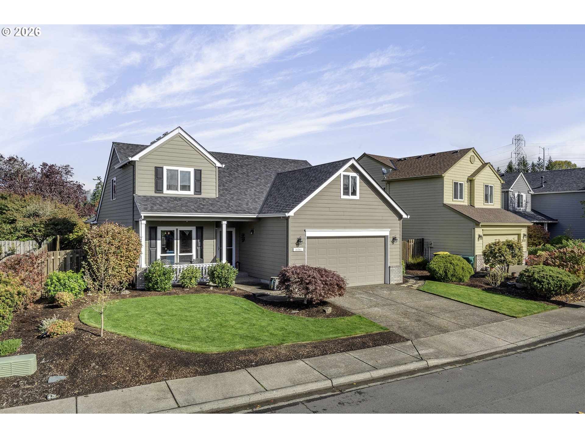 16761 Northwest Stoller Drive Portland, OR 97229 - Photo 1 of 35 a front view of a house with a garden and yard