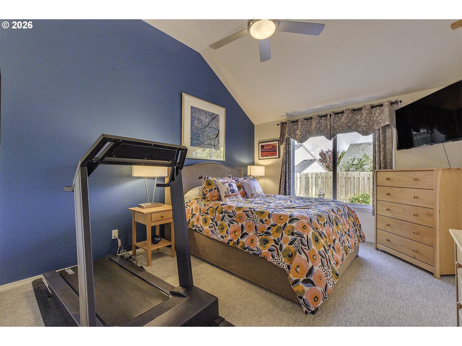 16761 Northwest Stoller Drive Portland, OR 97229 - Photo 11 of 35 a bedroom with a bed and a television