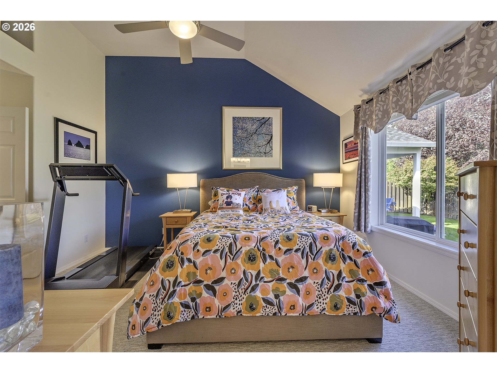 16761 Northwest Stoller Drive Portland, OR 97229 - Photo 12 of 35 a bedroom with a bed and a flat tv screen on dresser