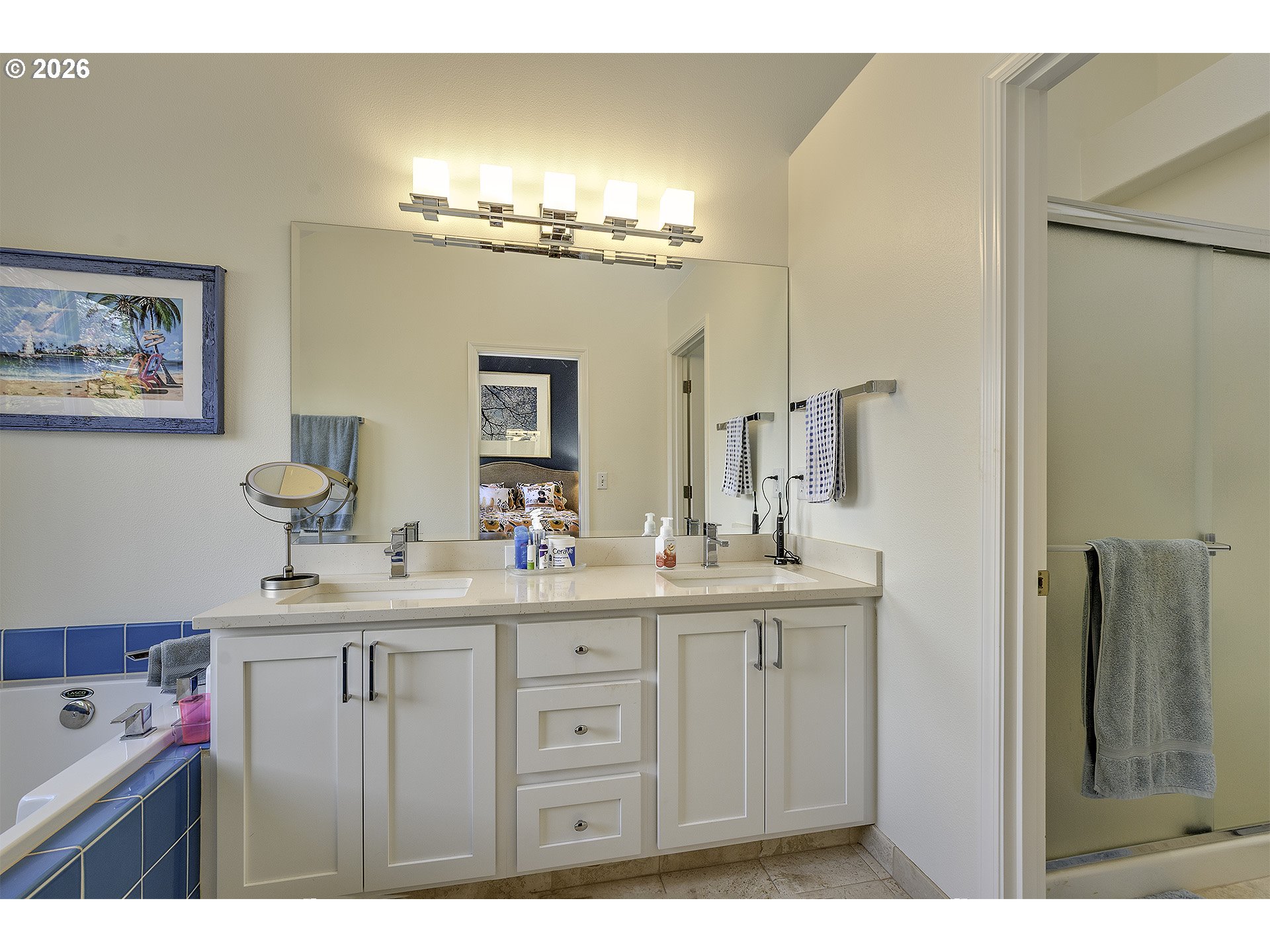 16761 Northwest Stoller Drive Portland, OR 97229 - Photo 15 of 35 a en suite bathroom with a sink and a mirror
