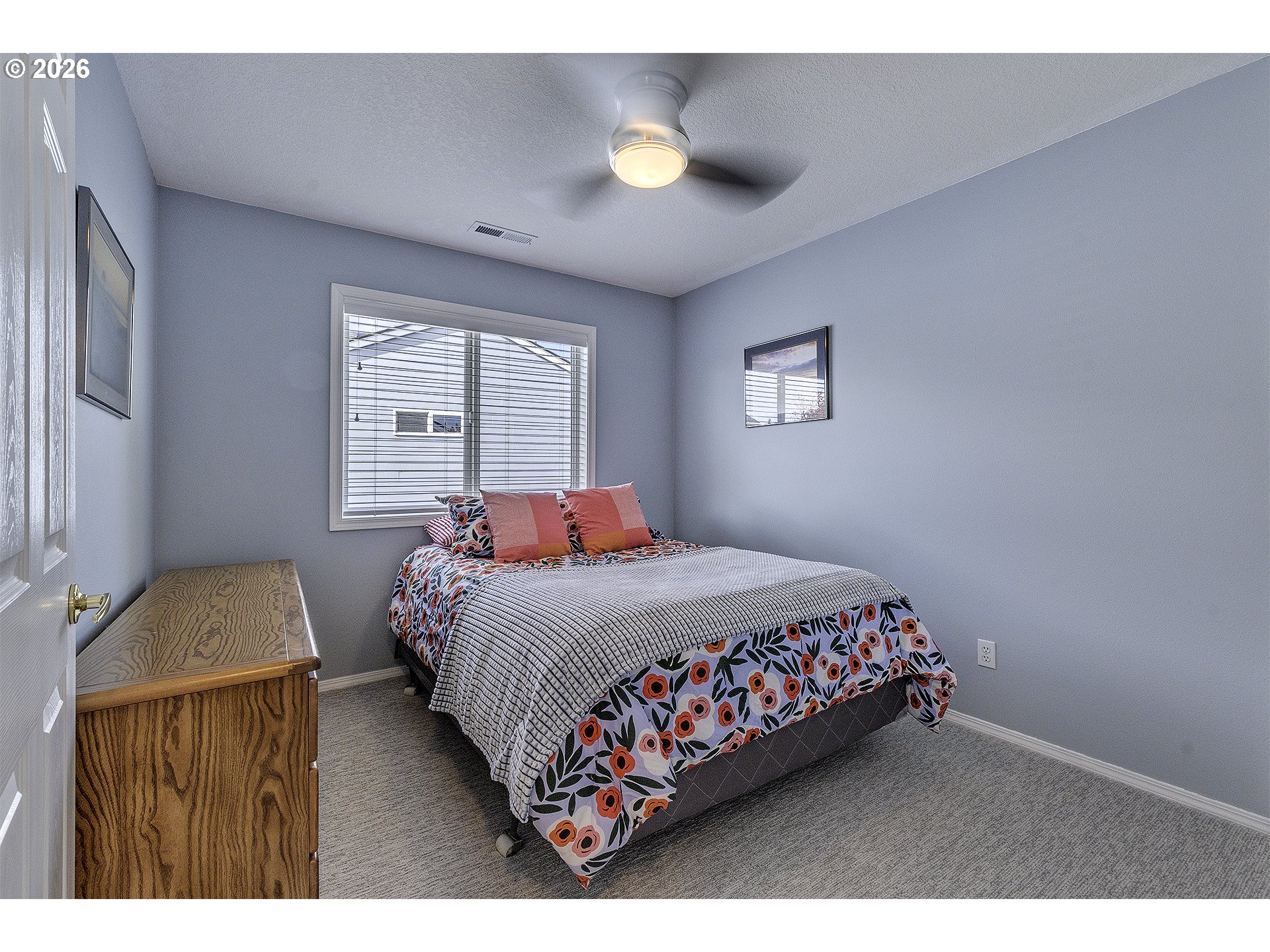 16761 Northwest Stoller Drive Portland, OR 97229 - Photo 19 of 35 a bedroom with a bed and window