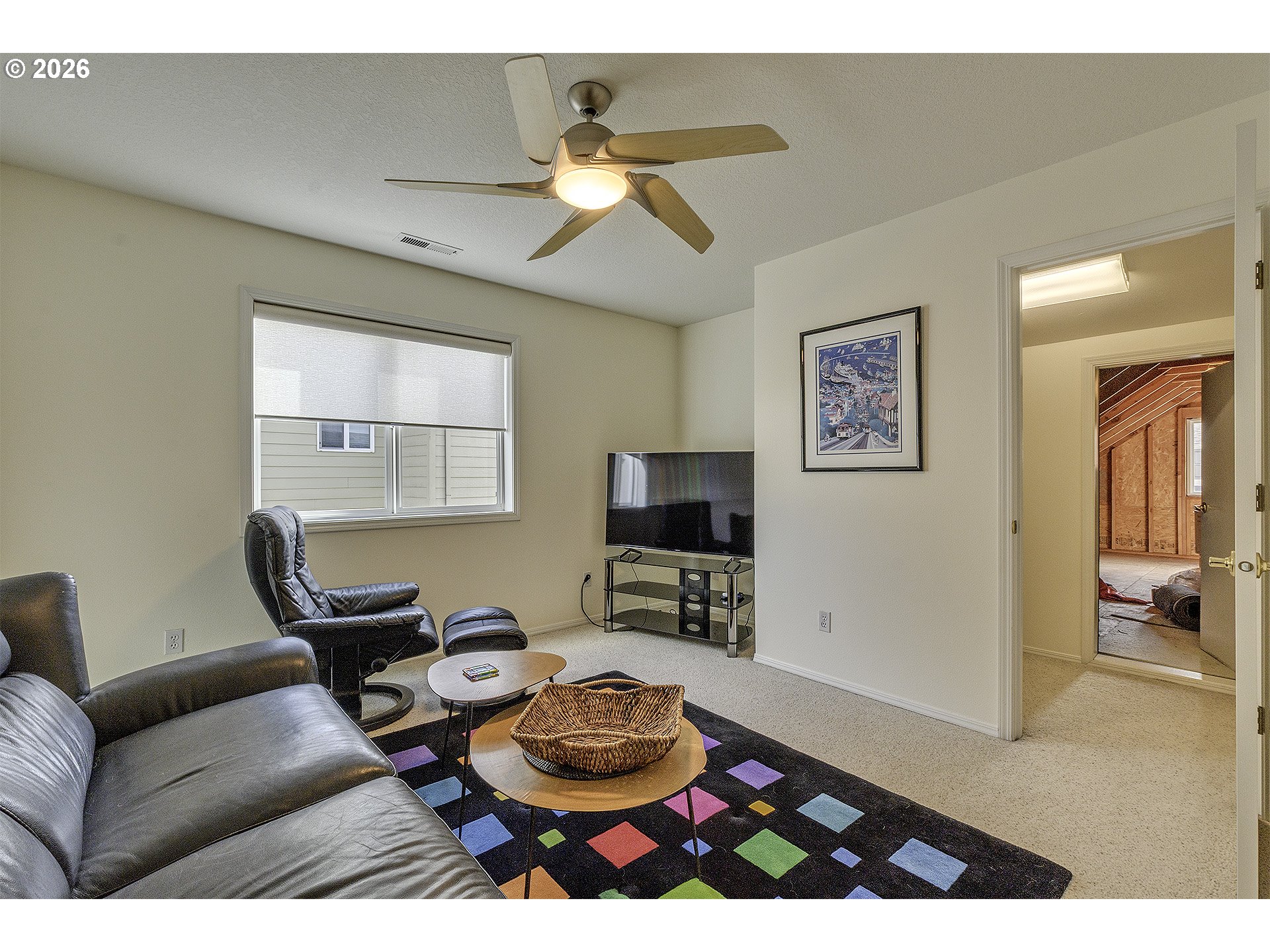 16761 Northwest Stoller Drive Portland, OR 97229 - Photo 21 of 35 a living room with furniture a flat screen tv and a window