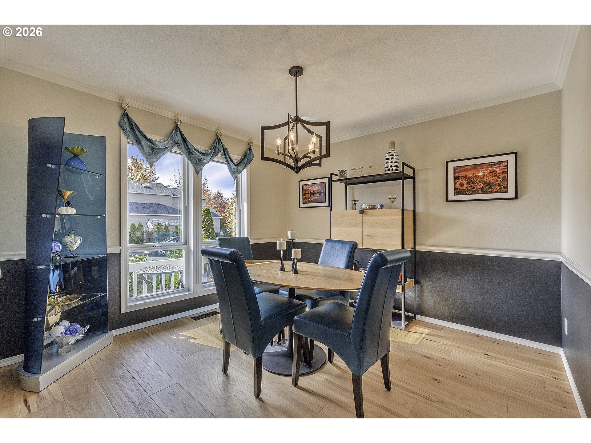 16761 Northwest Stoller Drive Portland, OR 97229 - Photo 26 of 35 a view of a dining room with furniture wooden floor and a chandelier