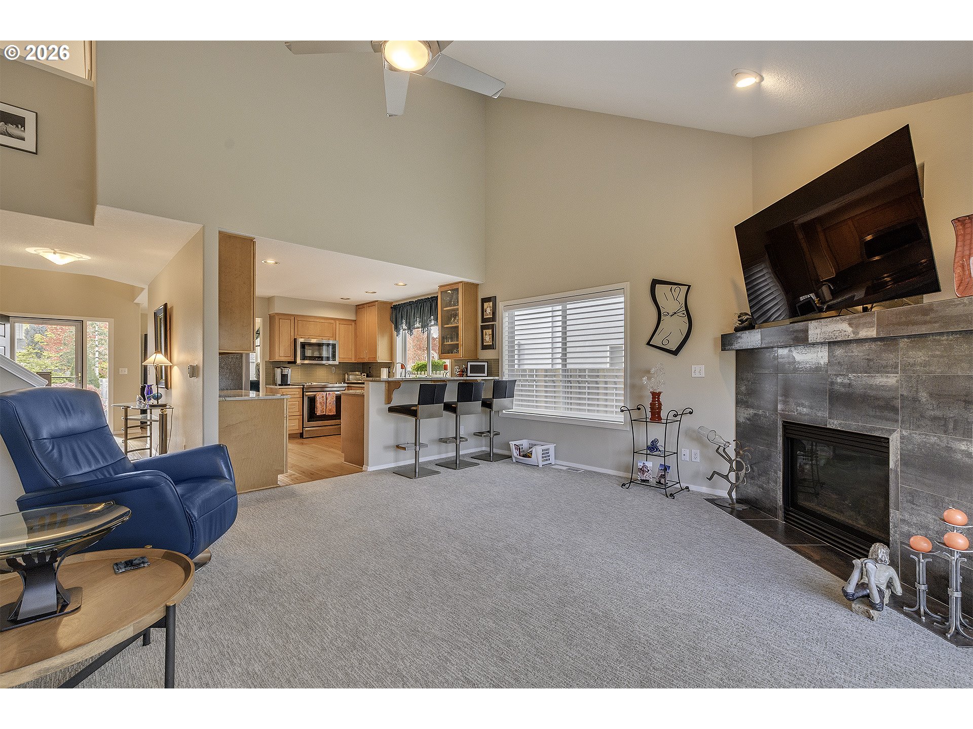 16761 Northwest Stoller Drive Portland, OR 97229 - Photo 27 of 35 a living room with furniture a flat screen tv and a fireplace