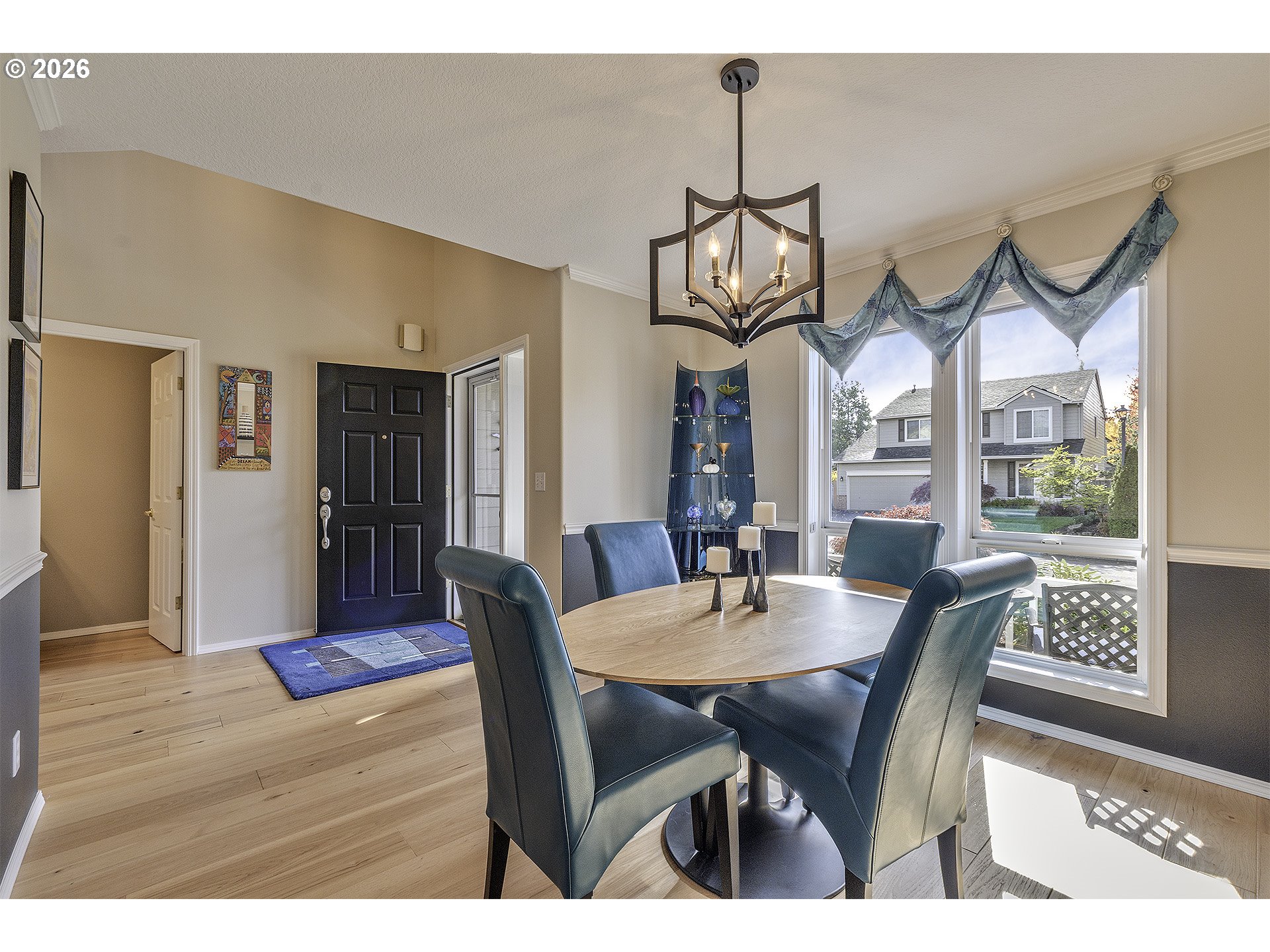 16761 Northwest Stoller Drive Portland, OR 97229 - Photo 3 of 35 a view of a dining room with furniture window and wooden floor