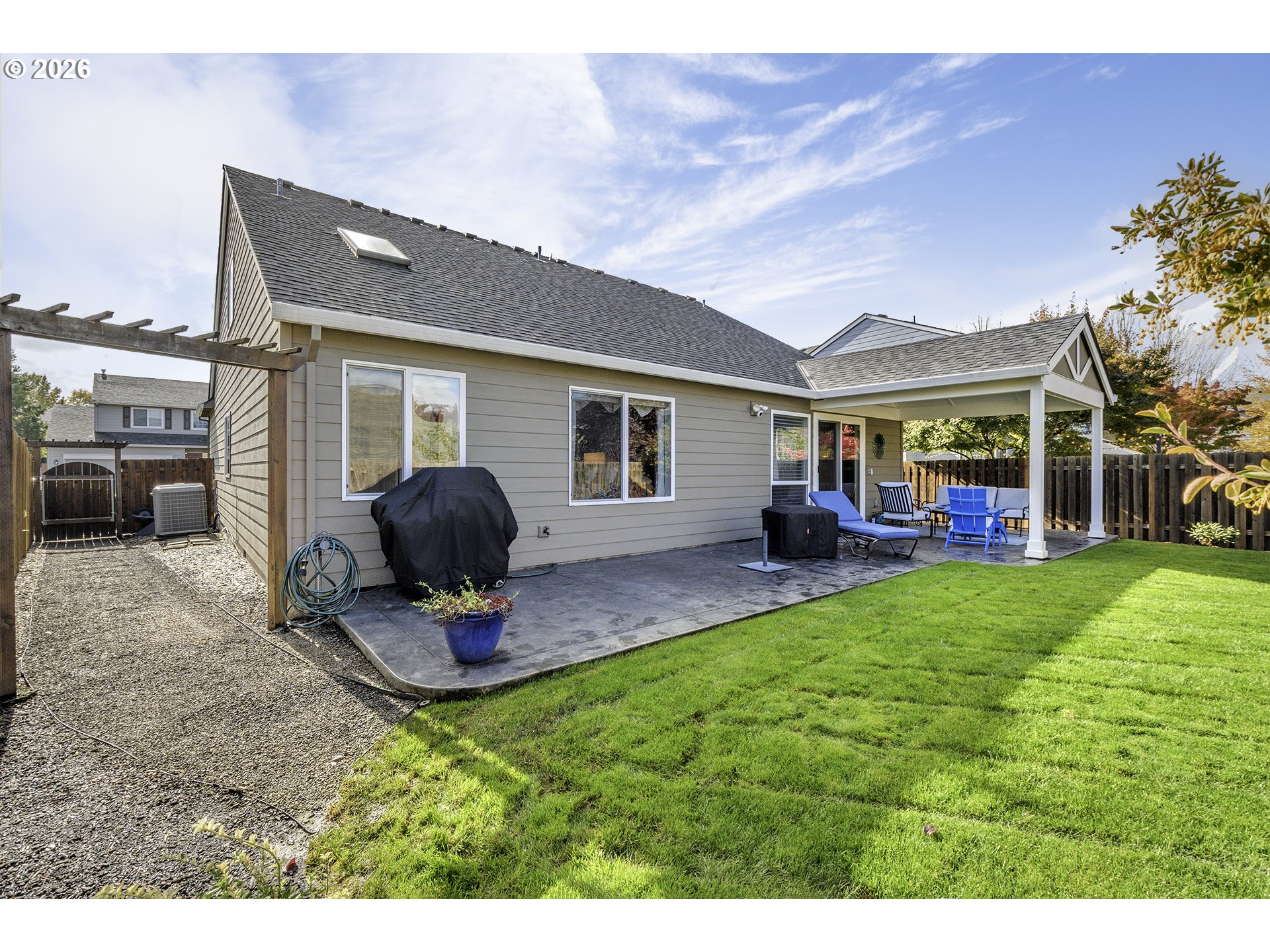 16761 Northwest Stoller Drive Portland, OR 97229 - Photo 35 of 35 a view of a house with a backyard porch and sitting area