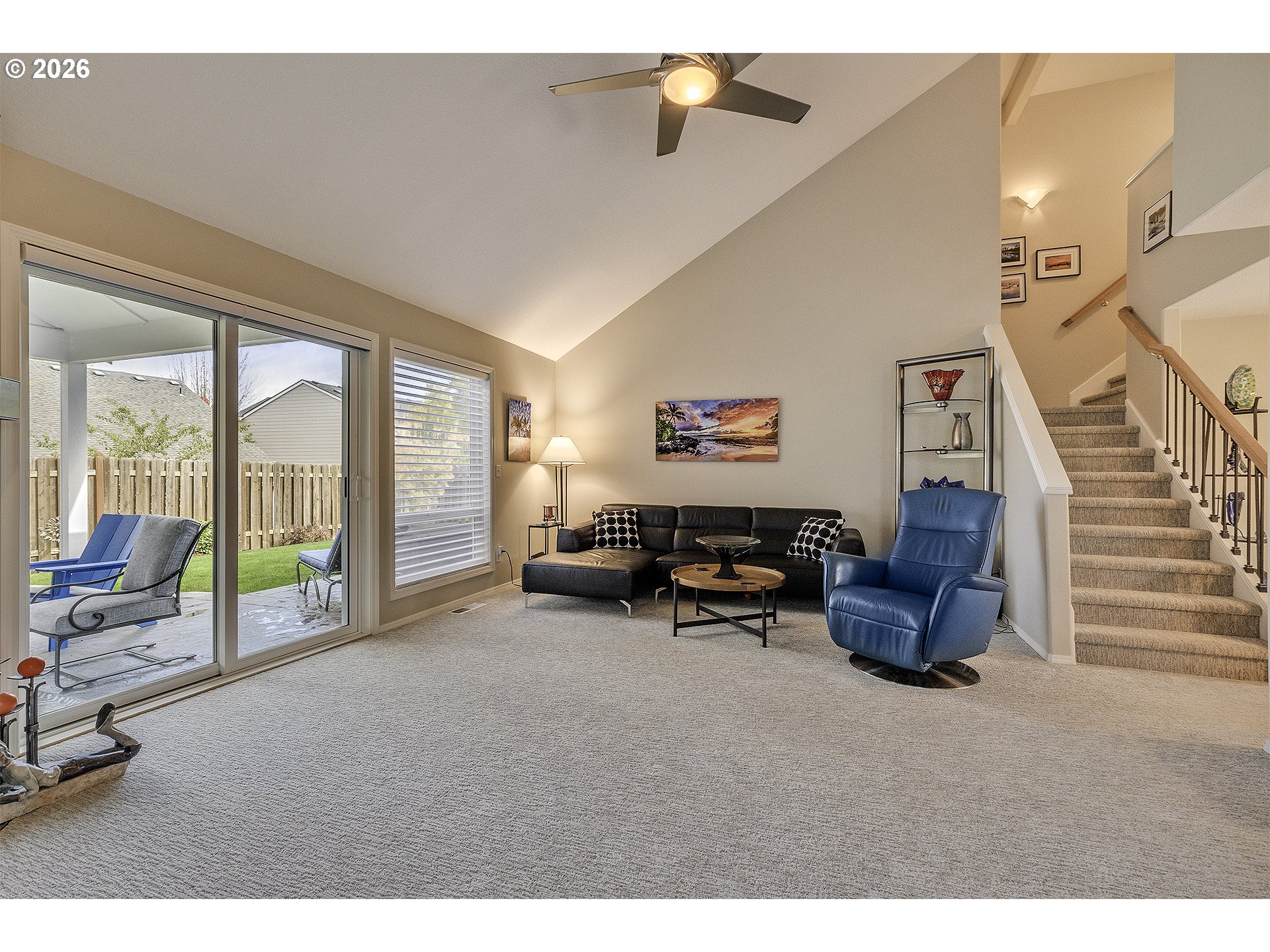 16761 Northwest Stoller Drive Portland, OR 97229 - Photo 6 of 35 a living room with furniture and a floor to ceiling window