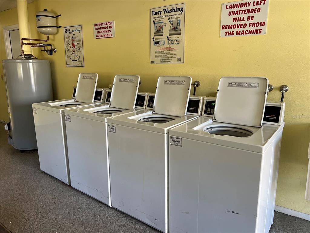 5521 Bay Boulevard, Unit 105 Port Richey, FL 34668 - Photo 15 of 15 a utility room with dryer and washer