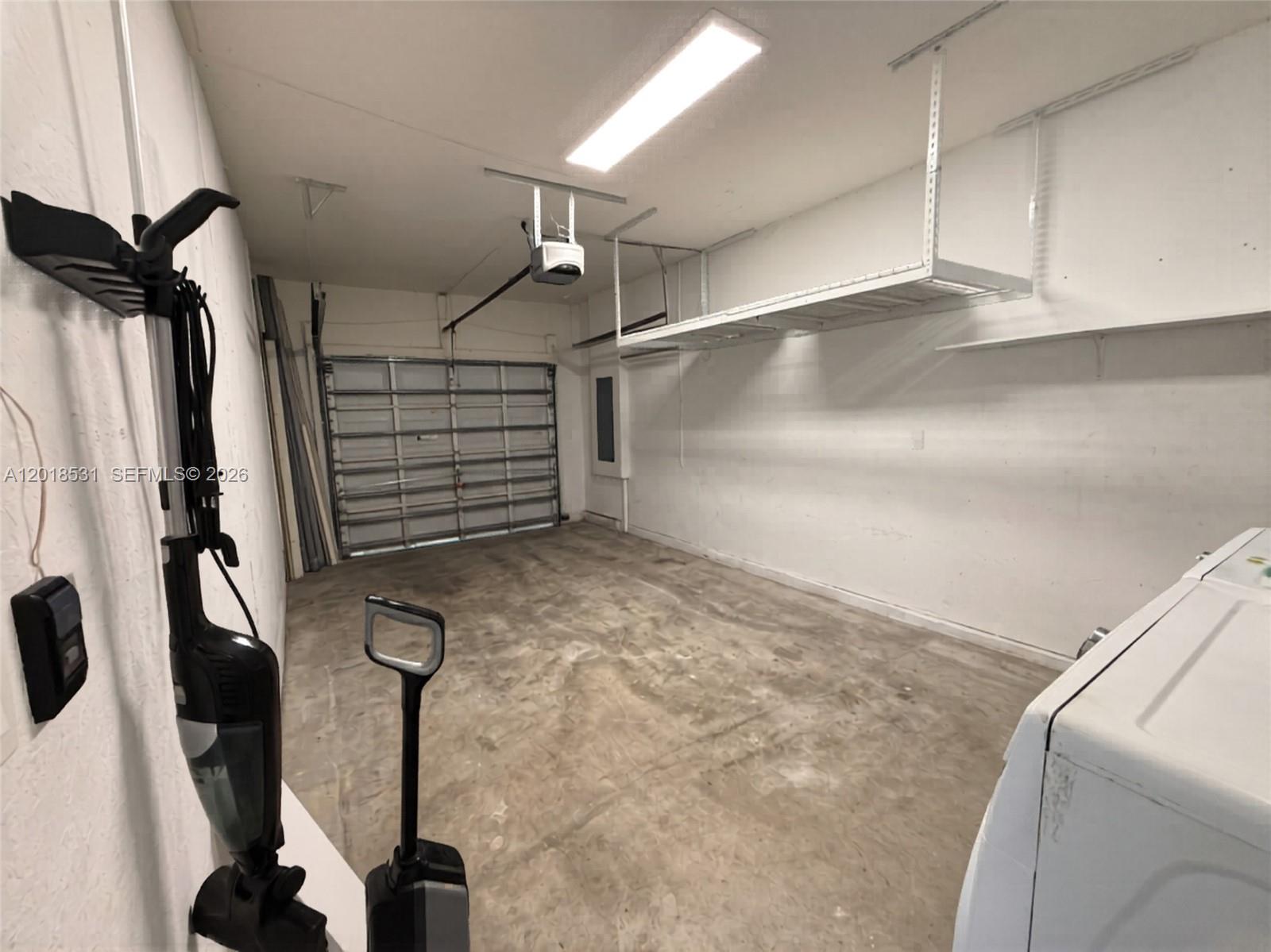 1575 Southeast 20th Road Homestead, FL 33035 - Photo 15 of 19 a view of walk in closet with clothes and white walls
