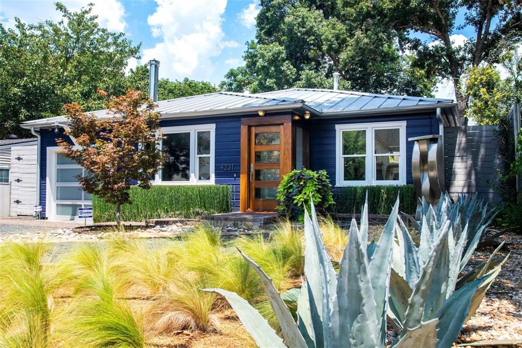 a view of a house with pool and sitting area