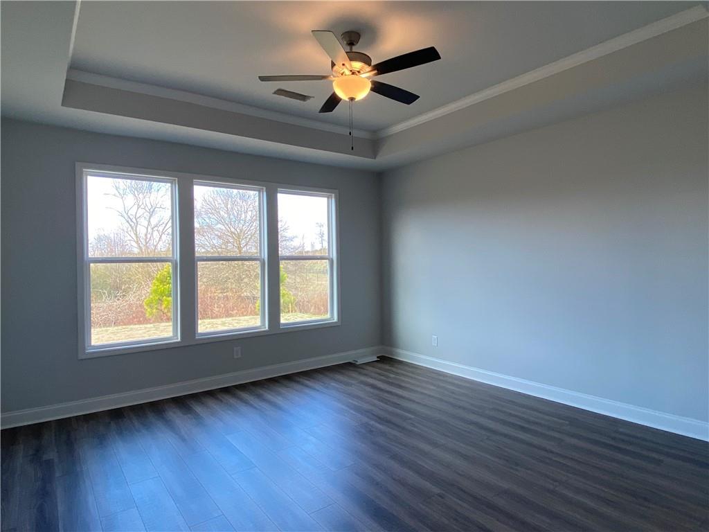 166 Montview Drive Jefferson, GA 30549 - Photo 12 of 52 a view of an empty room with wooden floor and a window