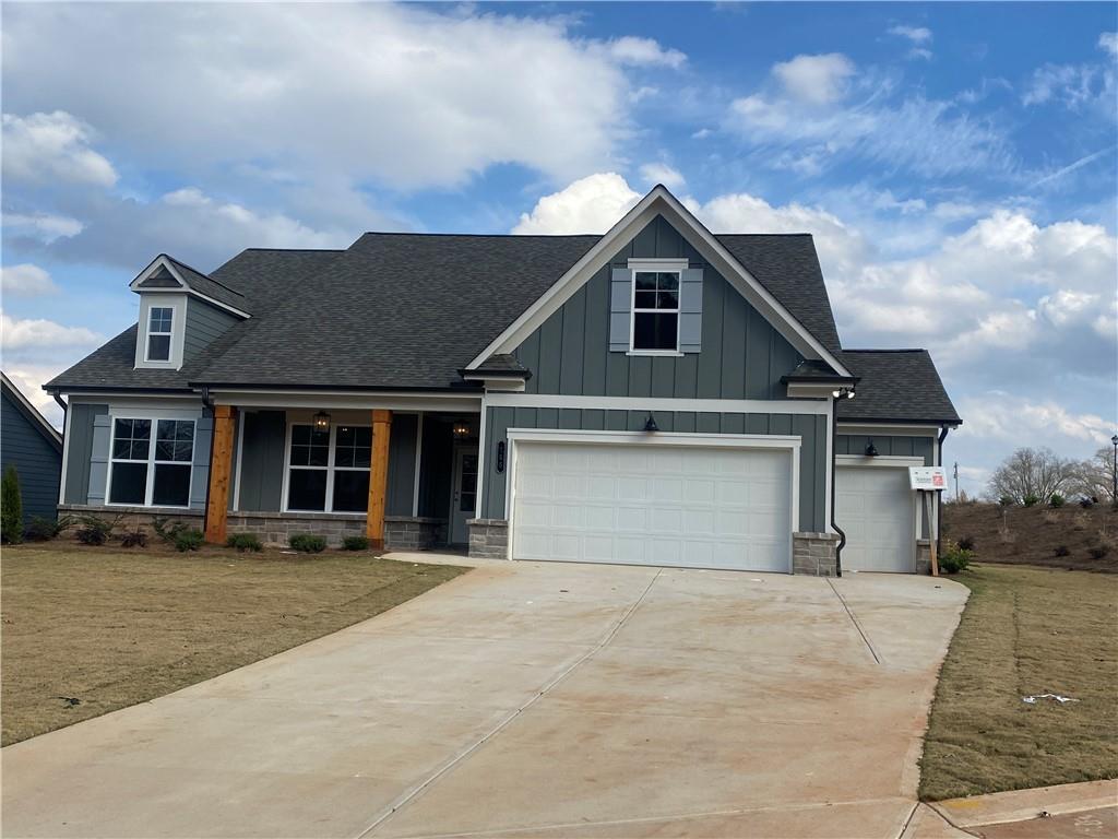 166 Montview Drive Jefferson, GA 30549 - Photo 3 of 52 a front view of a house with a garden