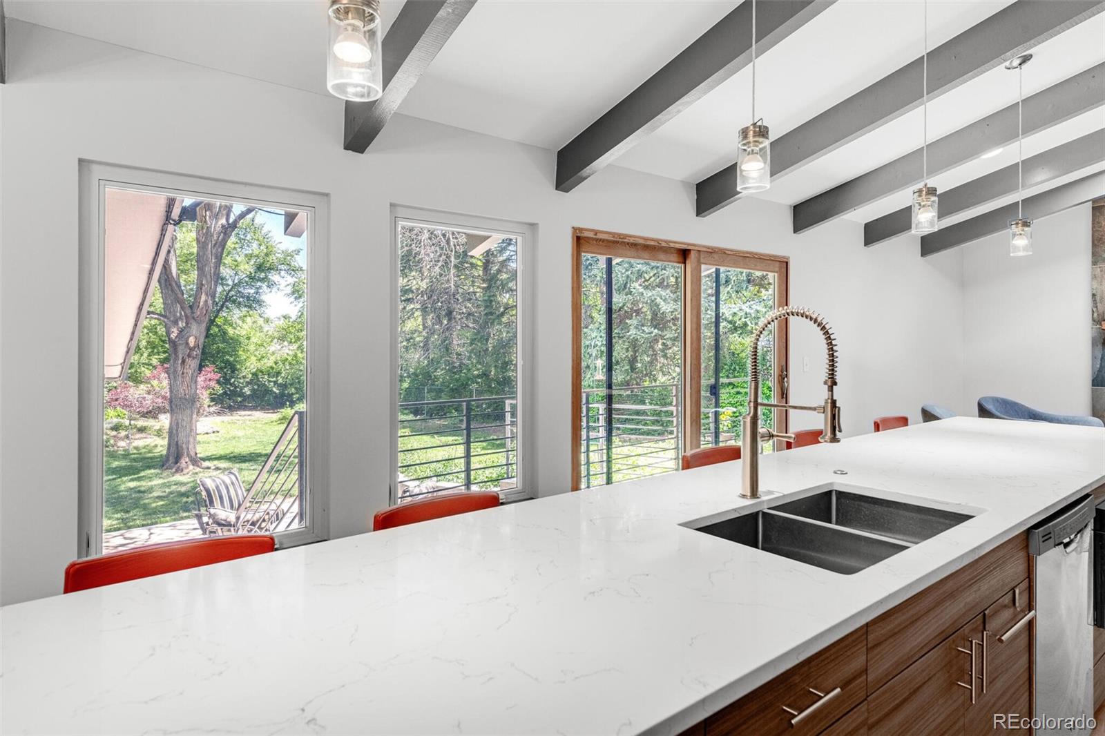 4595 West Lakeridge Road Denver, CO 80219 - Photo 16 of 45 a kitchen with a stove a sink and a large window