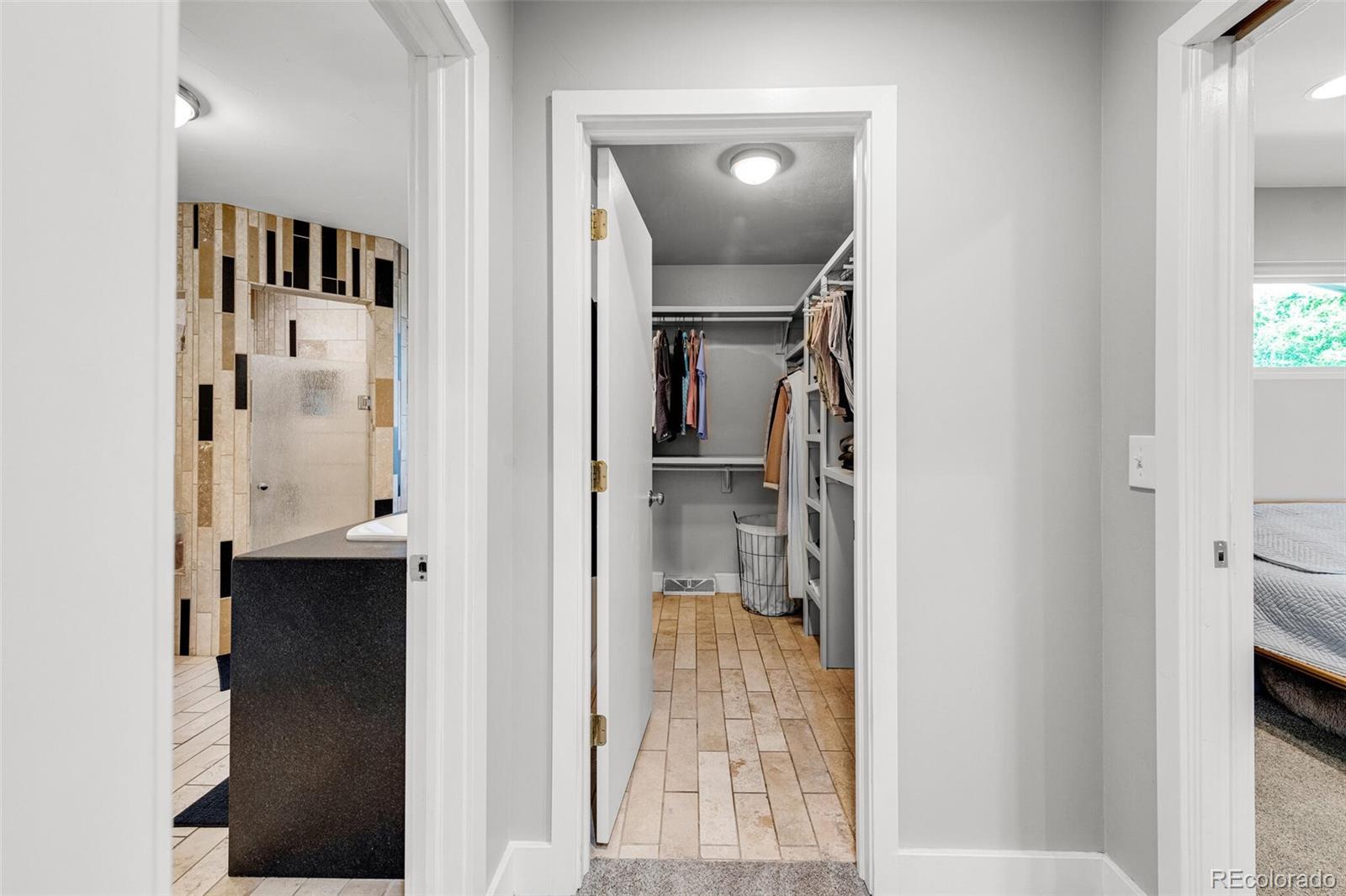 4595 West Lakeridge Road Denver, CO 80219 - Photo 20 of 45 a view of a bathroom from a hallway