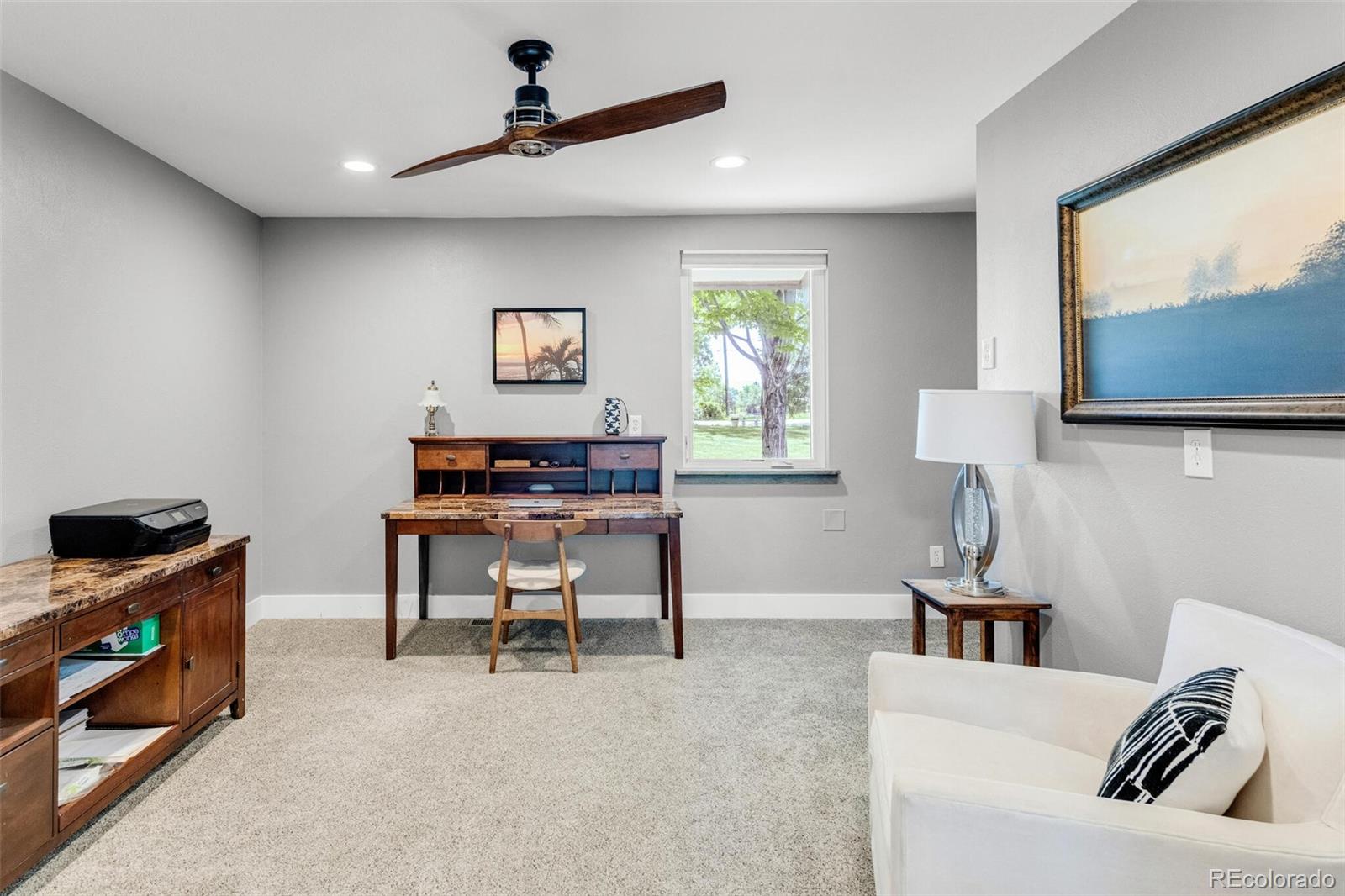 4595 West Lakeridge Road Denver, CO 80219 - Photo 27 of 45 a living room with furniture and a flat screen tv