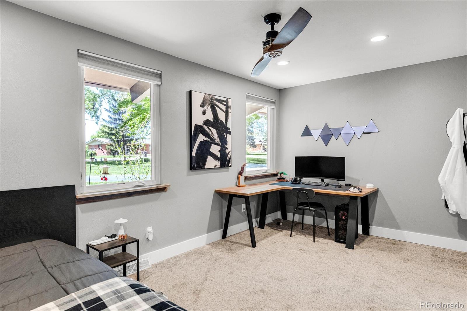 4595 West Lakeridge Road Denver, CO 80219 - Photo 29 of 45 a view of a workspace with furniture and a window