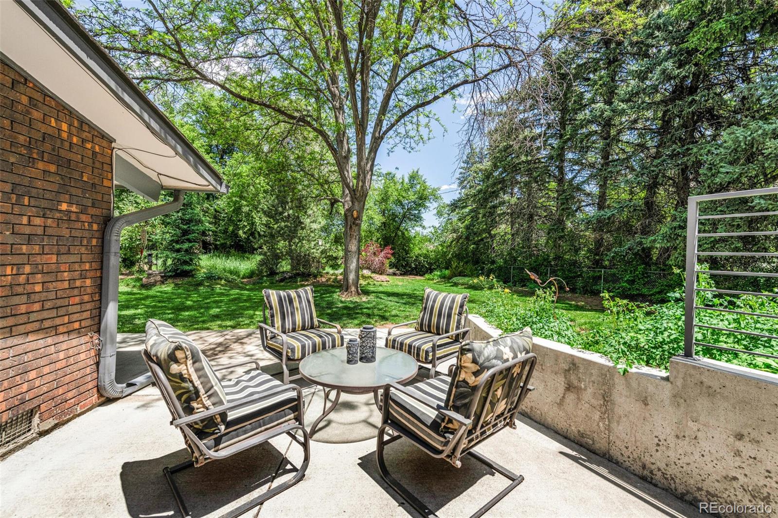 4595 West Lakeridge Road Denver, CO 80219 - Photo 35 of 45 a view of a patio with a yard
