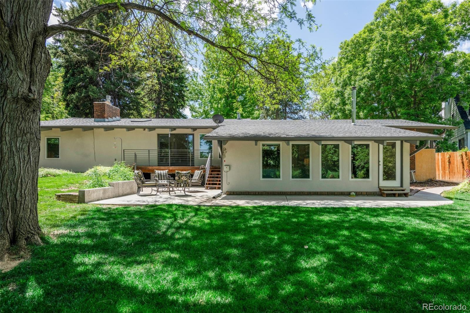4595 West Lakeridge Road Denver, CO 80219 - Photo 38 of 45 a view of a house with backyard and sitting area