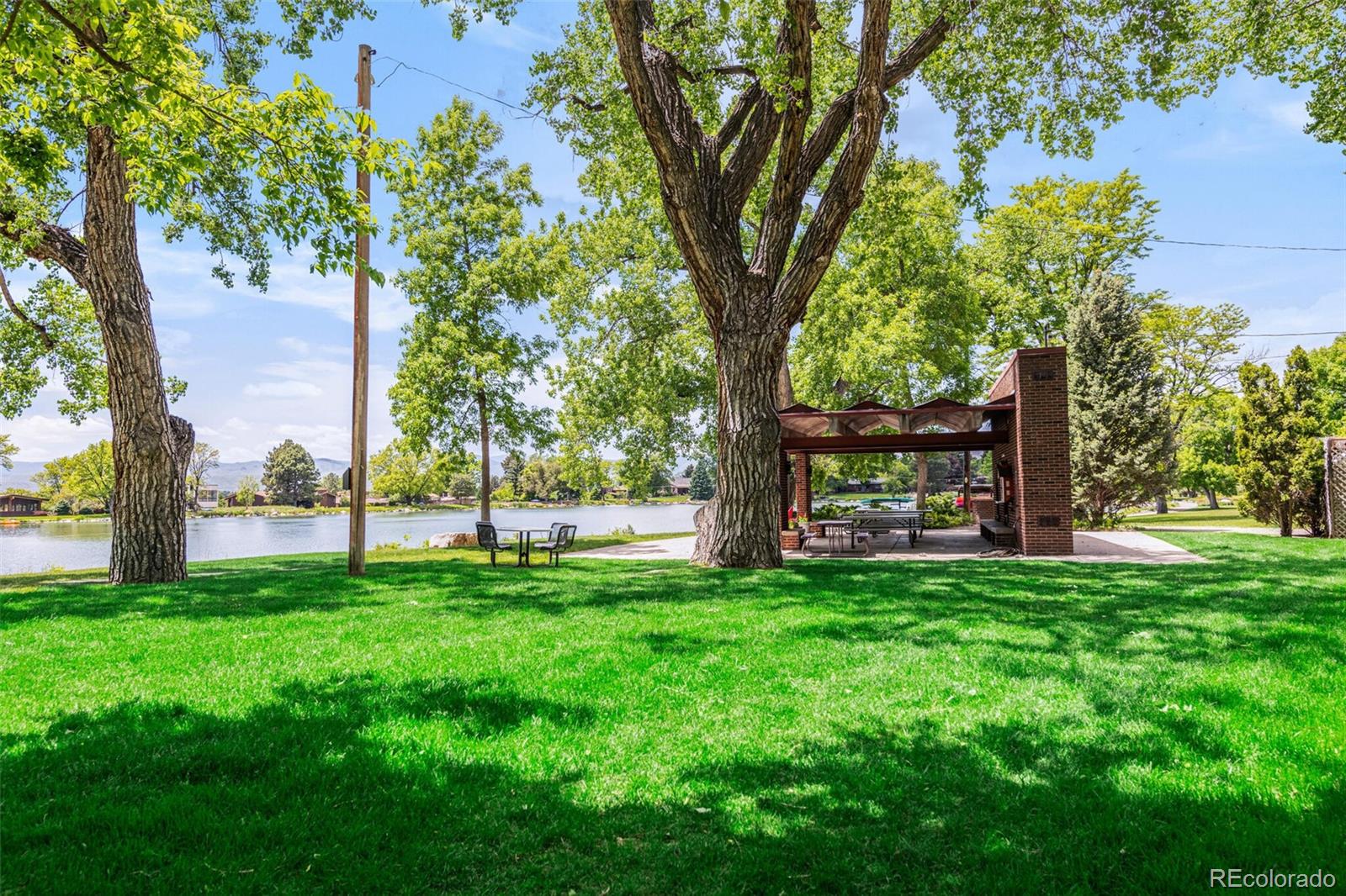 4595 West Lakeridge Road Denver, CO 80219 - Photo 39 of 45 a view of a backyard with large trees